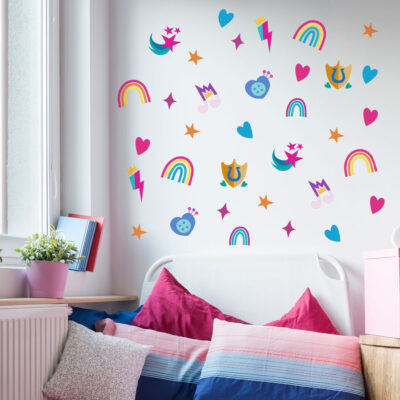 Cutie marks & rainbows wall sticker pack shown on a white wall behind a pink and blue bed next to a window