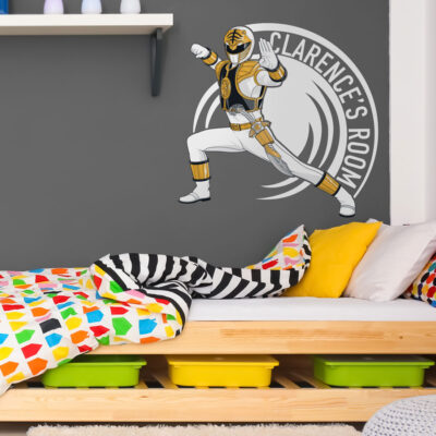 Personalised Rower Rangers wall sticker large white shown on a grey wall above a wooden bed with rainbow bedding