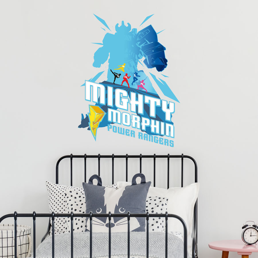 Mighty Morphin Power Rangers wall sticker shown on a white wall behind a black bed frame with white and grey bedding