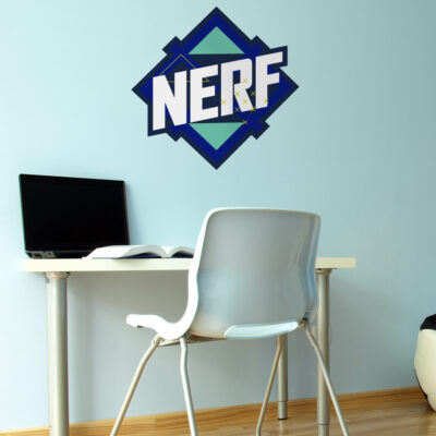 Blue Nerf logo wall sticker large shown on a light blue wall behind a white desk and chair