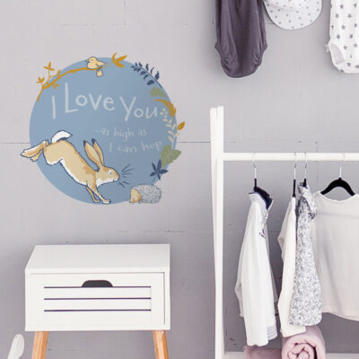 I love you wall sticker option 2 shown on a grey wall behind a white clothes rail