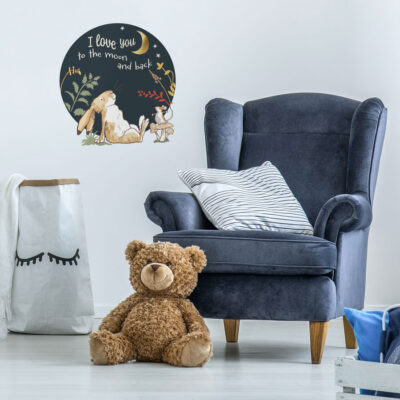 I love you wall sticker option 3 shown on a white wall behind a navy blue chair and brown teddy bear