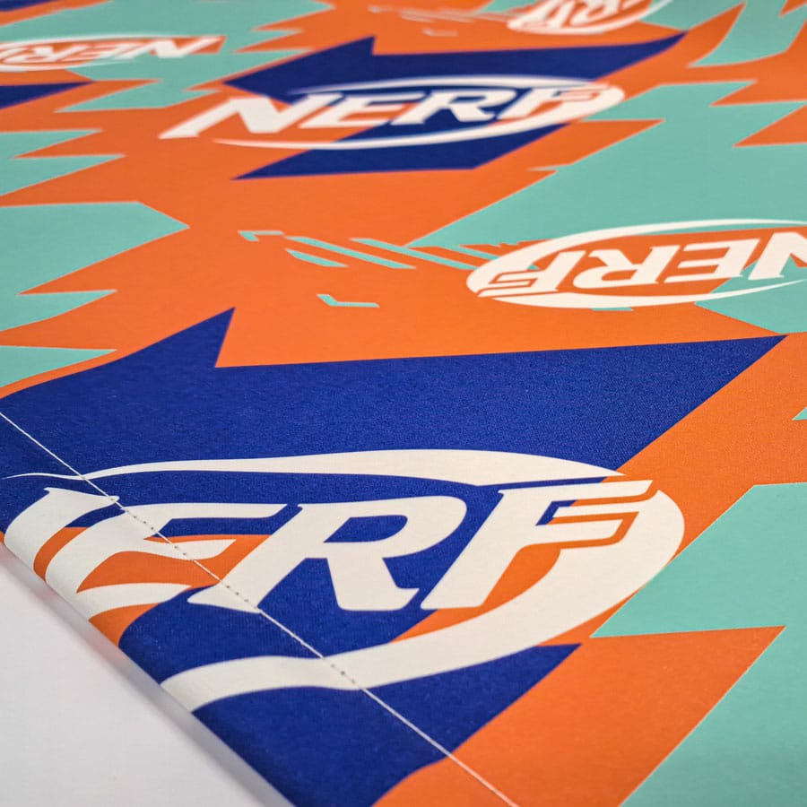 close-up of Orange Nerf roller blind showing bottom bar stitching