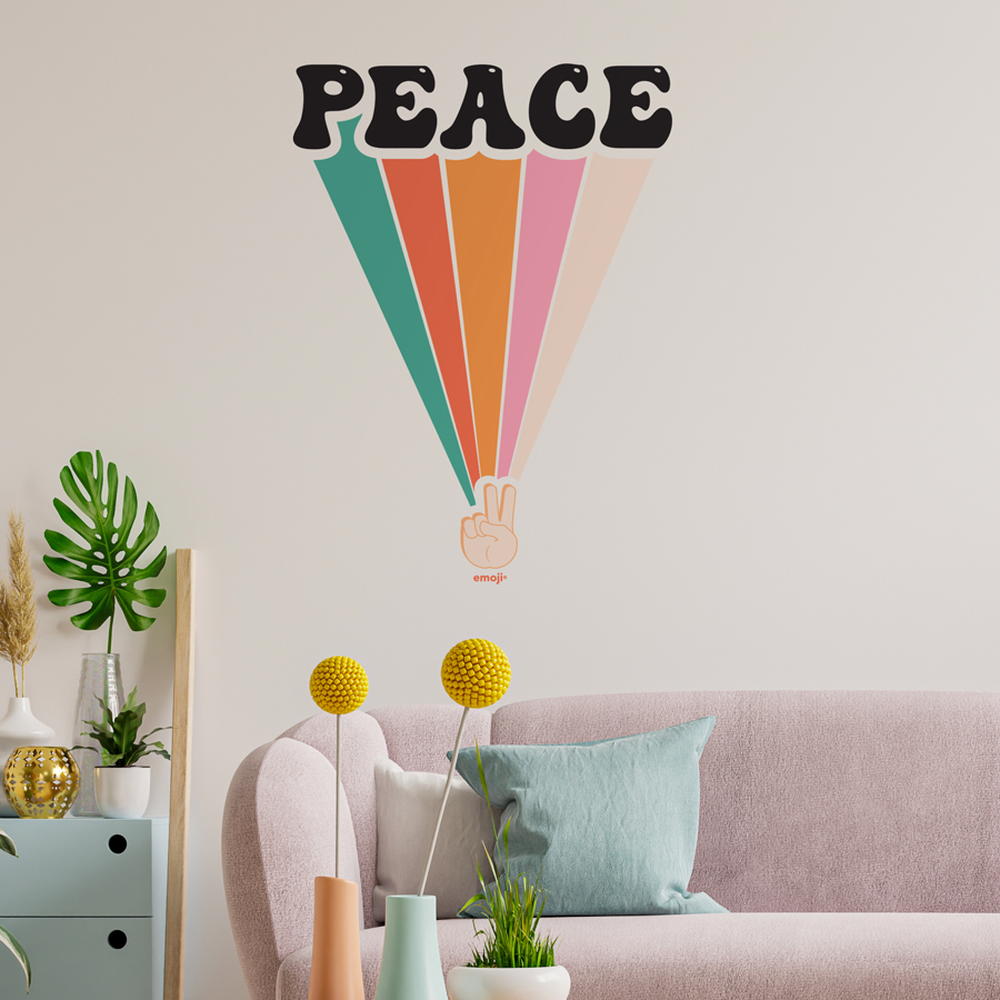 emoji peace rainbow wall sticker large shown on a white wall above a pink sofa with colourful cushions
