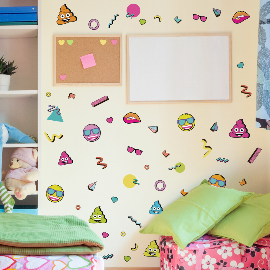 emoji 90's wall sticker pack regular shown on a light cream wall around a cork board and white board and behind a bed with bright pink and green bedding
