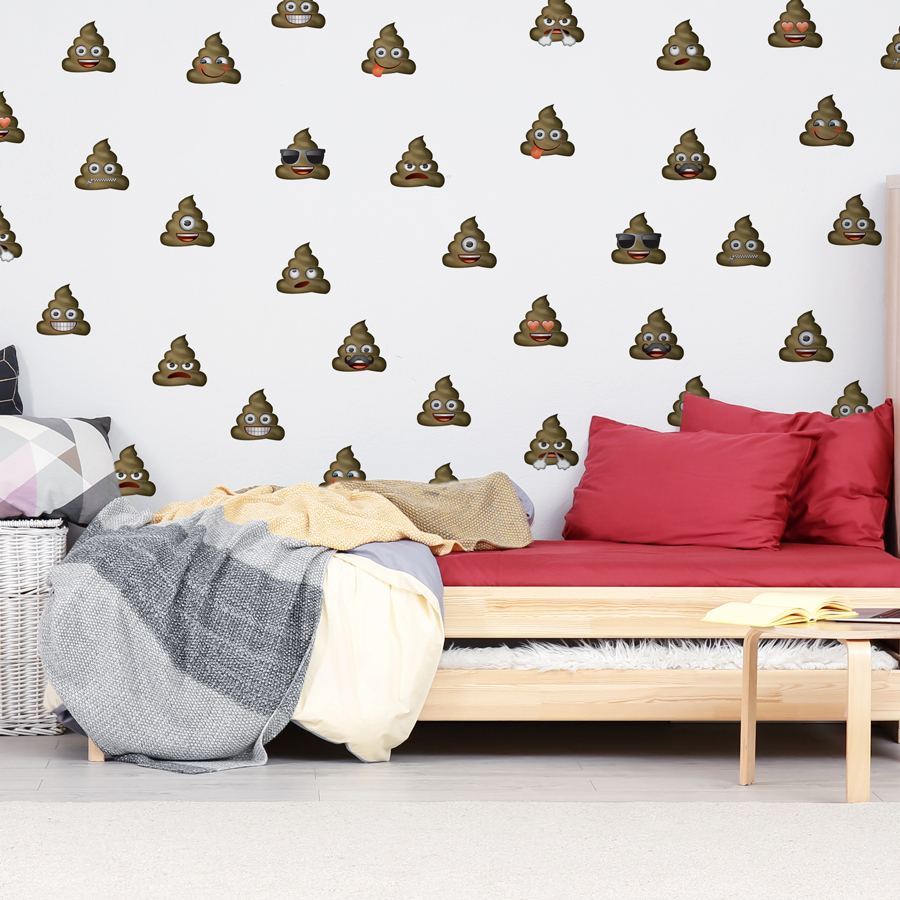 emoji poo wall sticker pack shown on a white wall behind a wooden bed with red and grey bedding