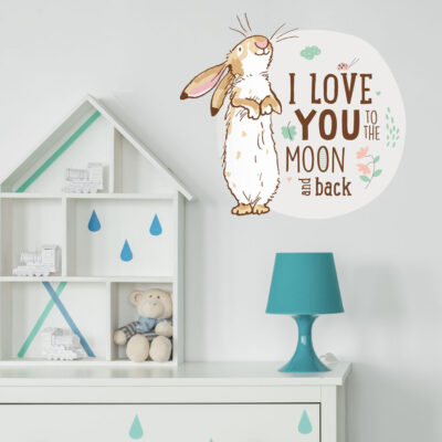 To the moon wall sticker option 1 shown on a white wall behind a white dresser with a blue lamp