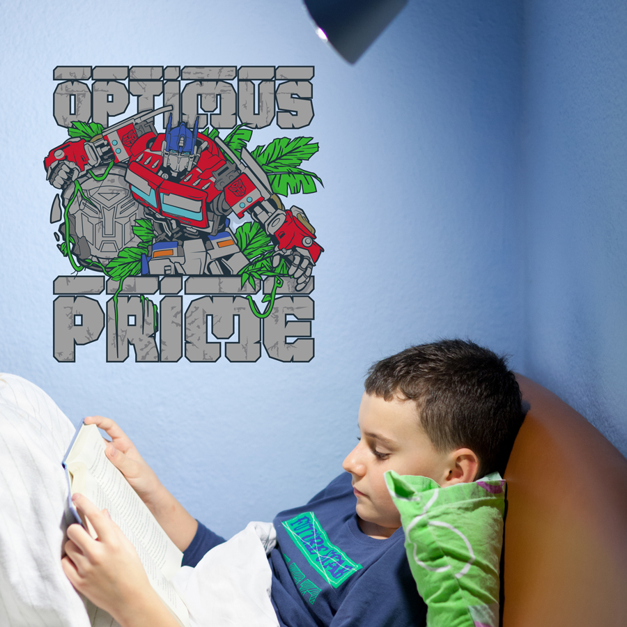 Optimus Prime wall sticker shown on a blue wall above a child reading.