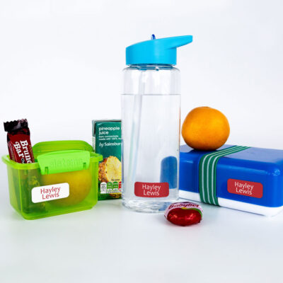 Red name labels on water bottle and lunch box and tupperware