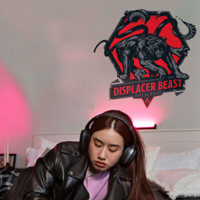 D&D Displacer Beast wall sticker shown on a grey wall above a girl on a bed.