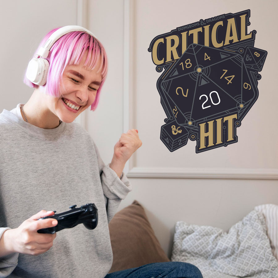 D&D Critical Hit Wall Sticker on a cream wall behind a woman playing games