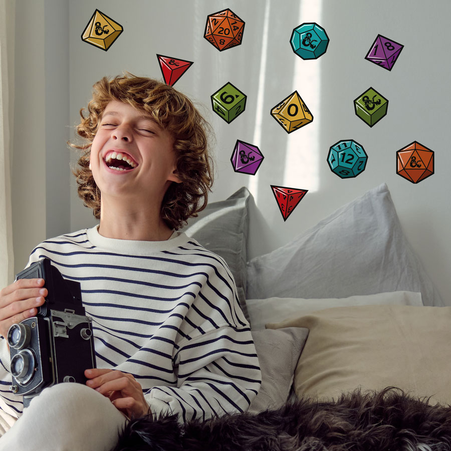 D&D Dice Stickers Pack on wall behind laughing child