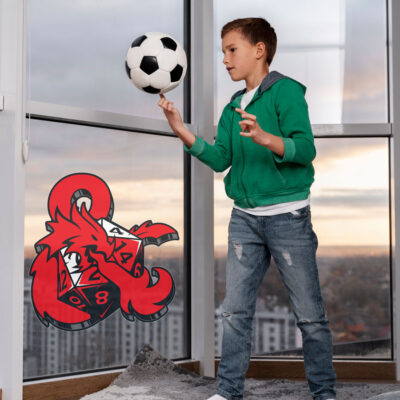 D&D Dice and Ampersand window sticker on window behind man boy playing with football
