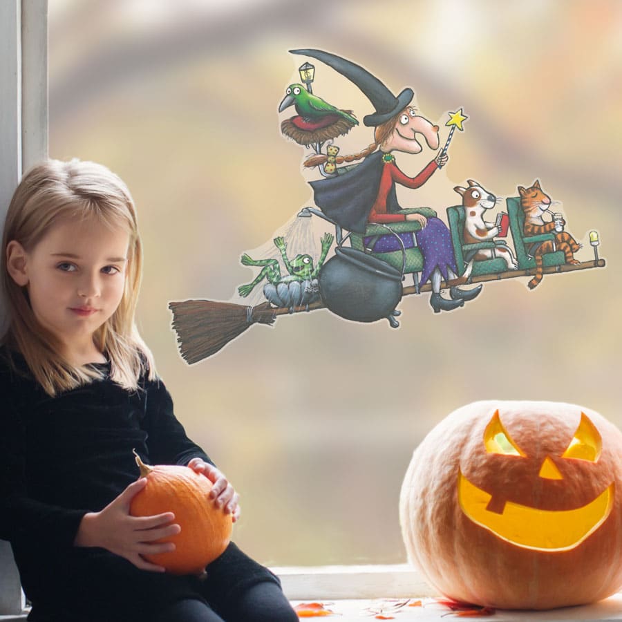 room on the broom busy broom window sticker on a window with pumpkin