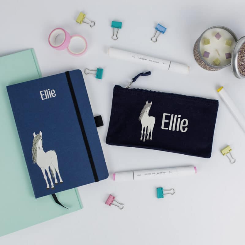 Horse themed pencil case and notebook in blue