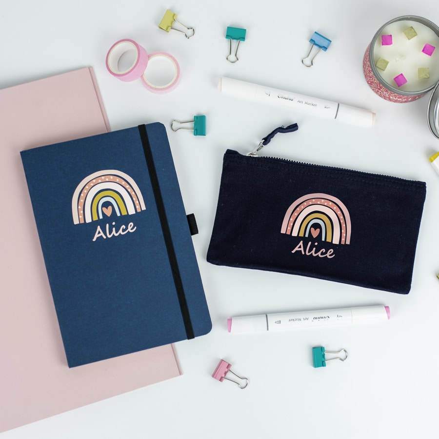Rainbow themed pencil case and notebook in blue