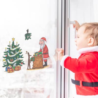 Stickman and Santa Christmas window sticker on a window with baby in santa outfit