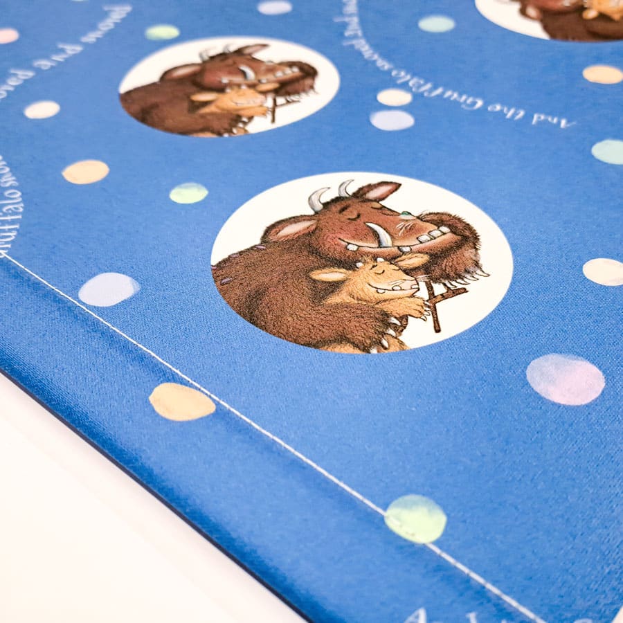 close-up of the gruffalo's child roller blind showing bottom bar with stitching and blue pattern
