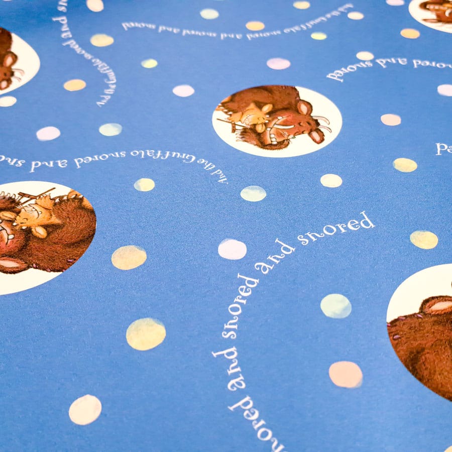 close-up of the gruffalo's child roller blind showing gruffalo themed pattern with blue background