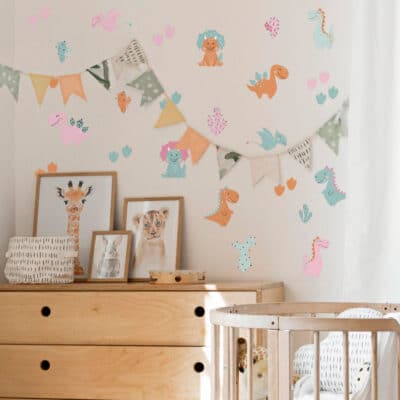 Pastel Dinosaur Wall Sticker in orange on a white wall