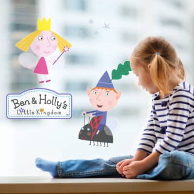 Ben & Holly Window Stickers on window behind child