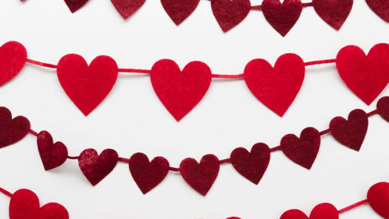 hearts from felt with string arts and crafts on a white background