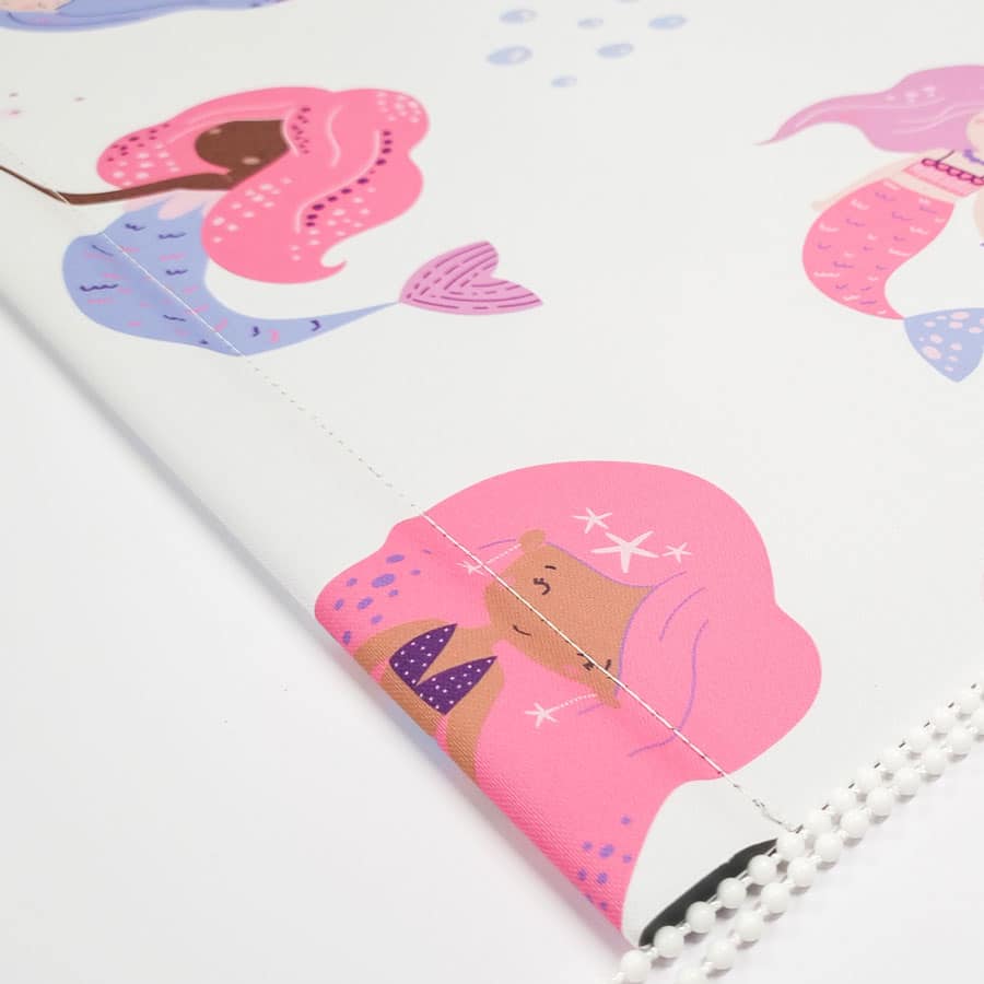 Pink Mermaids and Bubbles Roller Blind close-up showing chain and bottom bar stitching