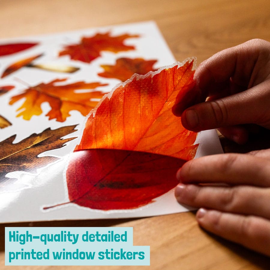 Autumnal Leaves and Mushrooms Window Sticker being removed from the backing sheet