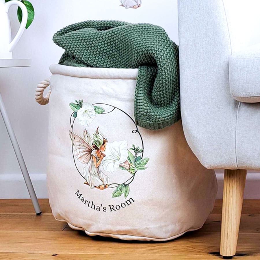personalised white bindweed storage trug with a chair and side table