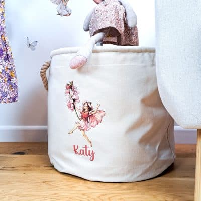 The Almond Blossom Storage Trug with plush toy going into trug