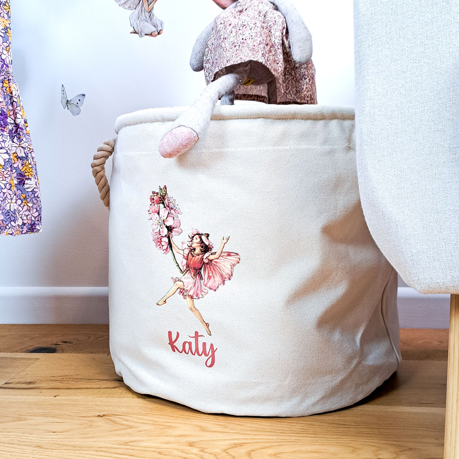 The Almond Blossom Storage Trug with plush toy going into trug
