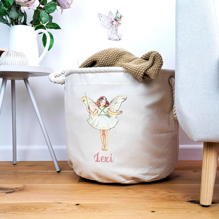 Personalised Christmas Tree storage trug in a room with flowers and a chair holding a blanket