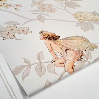 close-up of the jasmine flower fairy roller blind showing the bottom bar with stitching and white chain