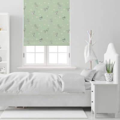 The Green Procession Flower Fairy roller blind installed in a white neutral bedroom