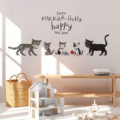 Tabby McTat Family Wall Sticker on a wall in a child's bedroom above children's toys