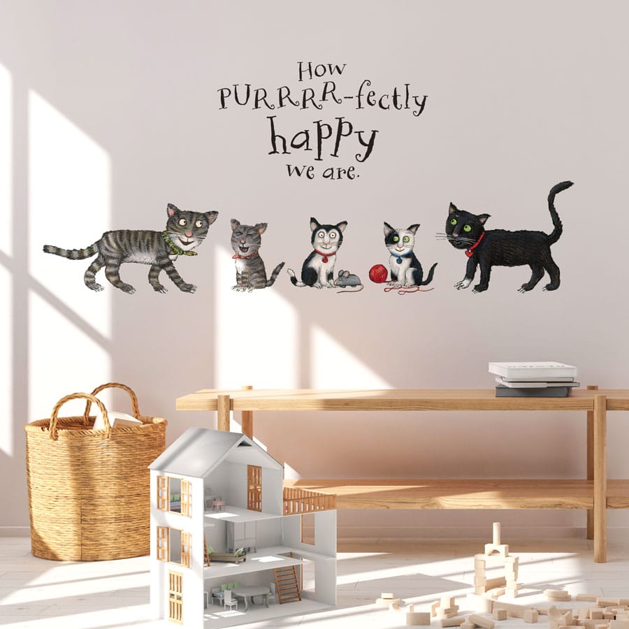 Tabby McTat Family Wall Sticker on a wall in a child's bedroom above children's toys