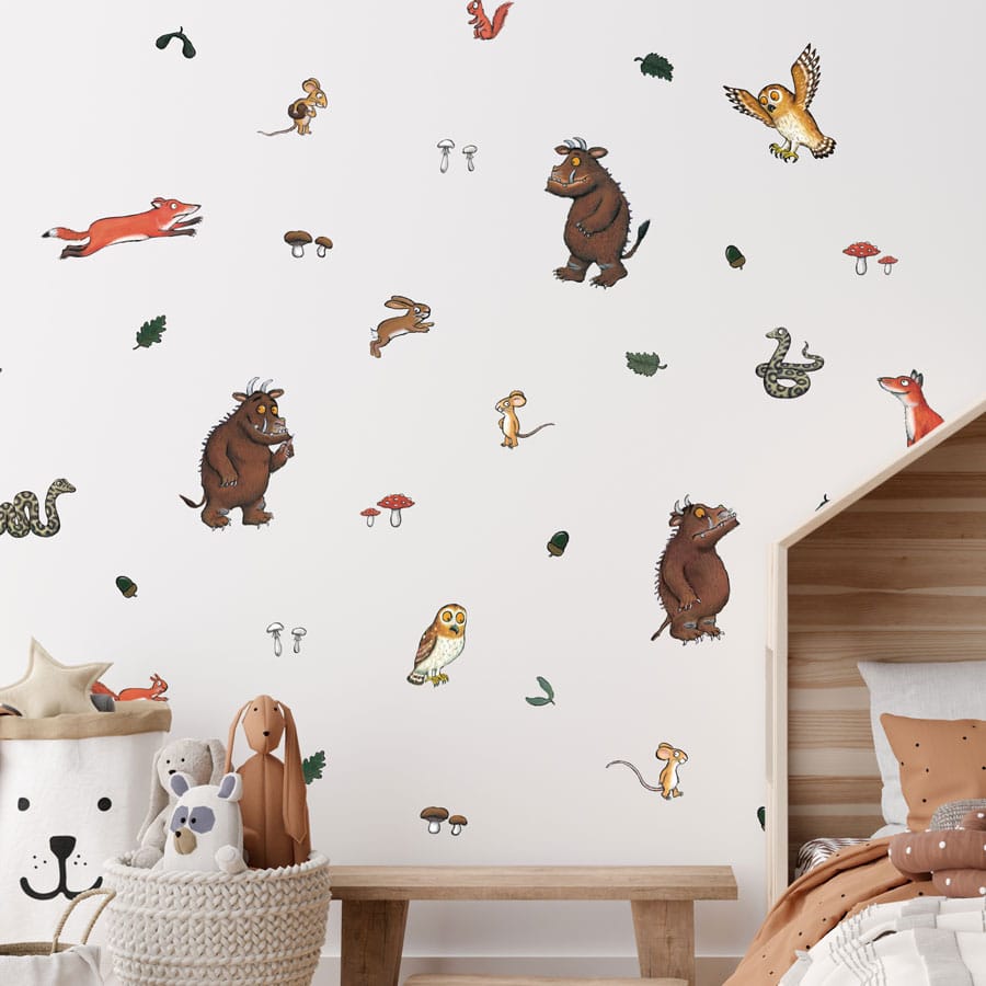 The Gruffalo Wall Stickers on a child's bedroom wall next to a bed and toys