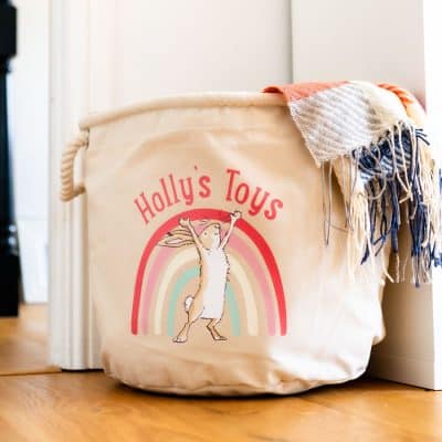 Guess How Much I Love You nursery storage basket with rope handles and personalised text, styled in a baby’s room for toy or blanket storage.