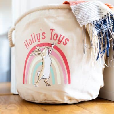 Canvas soft storage basket with Guess How Much I Love You rainbow illustration and name personalisation, perfect for baby’s nursery organisation.