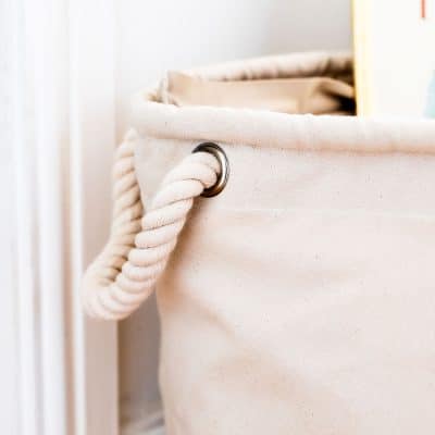 Detail of heavyweight rope handle on a natural cotton soft storage basket – part of the Guess How Much I Love You nursery storage collection.