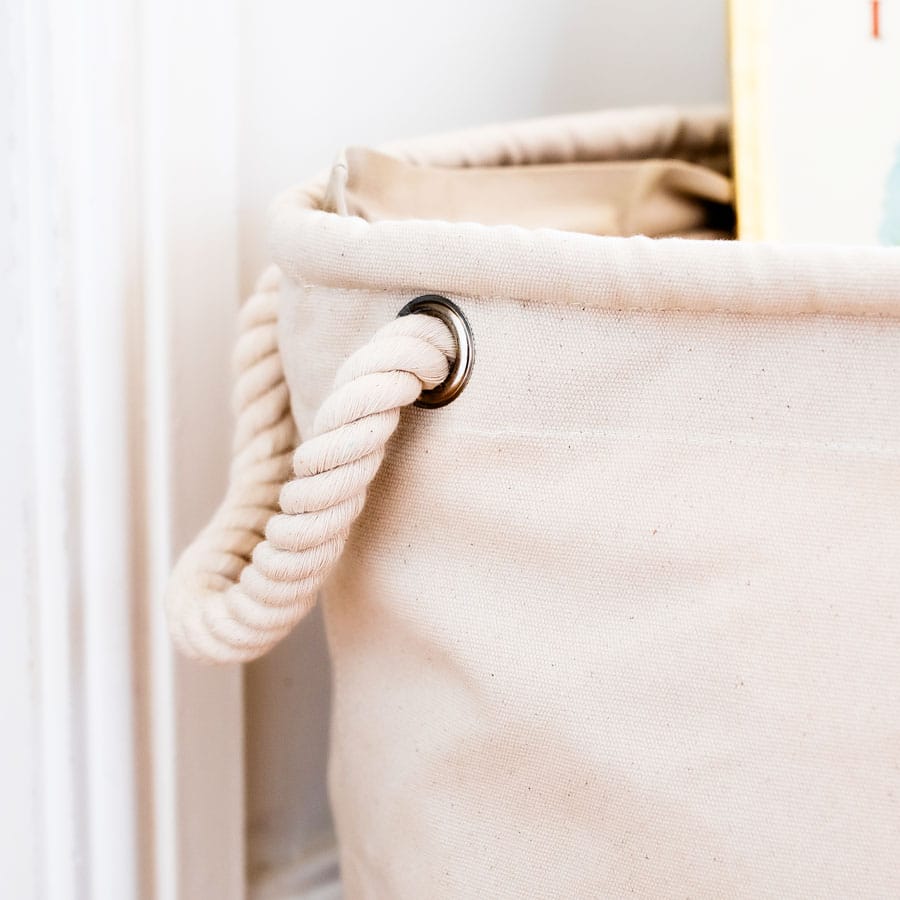 Detail of heavyweight rope handle on a natural cotton soft storage basket – part of the Guess How Much I Love You nursery storage collection.