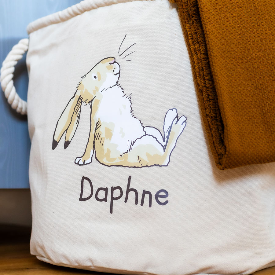 Close-up of nursery storage basket featuring Little Nutbrown Hare and natural cotton canvas fabric – part of the Guess How Much I Love You range.