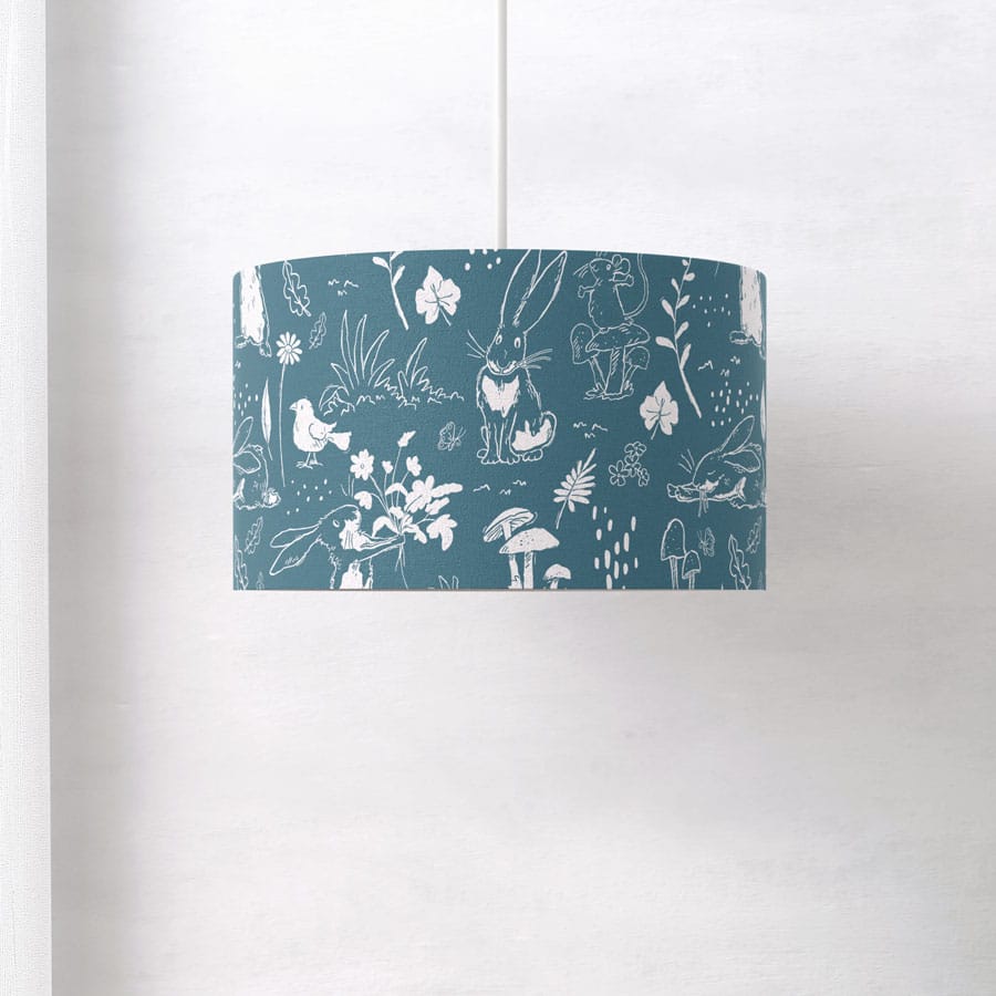 Side view of Blue Sketch Hares lampshade, highlighting the seamless printed fabric and delicate white hare and floral illustrations.
