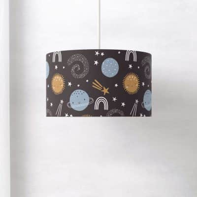 blue and gold space themed lampshade on a white background
