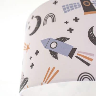 Close-up of scandi space lampshade showing rocket and spaceship pattern