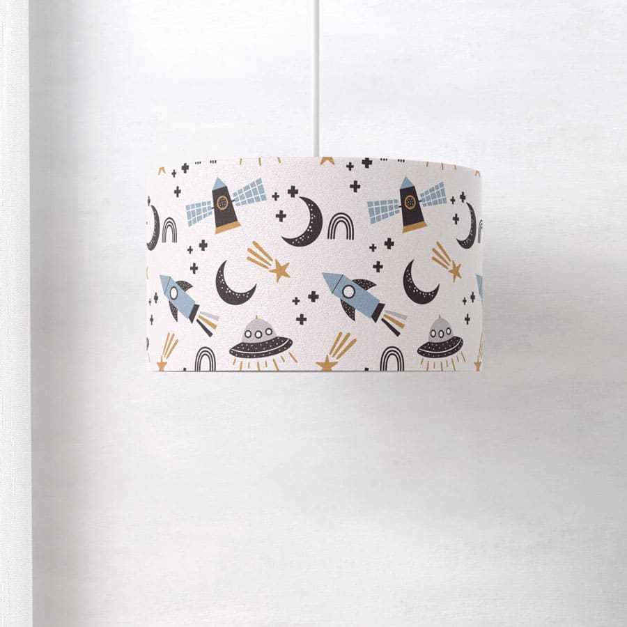 Scandi Space lampshade photographed from a side angle, showing the seamless wraparound design with soft-toned space elements on a white backdrop.
