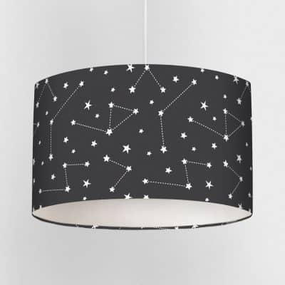 Dark constellation lampshade with seamless white star and constellation pattern on a deep charcoal background, shown close up.