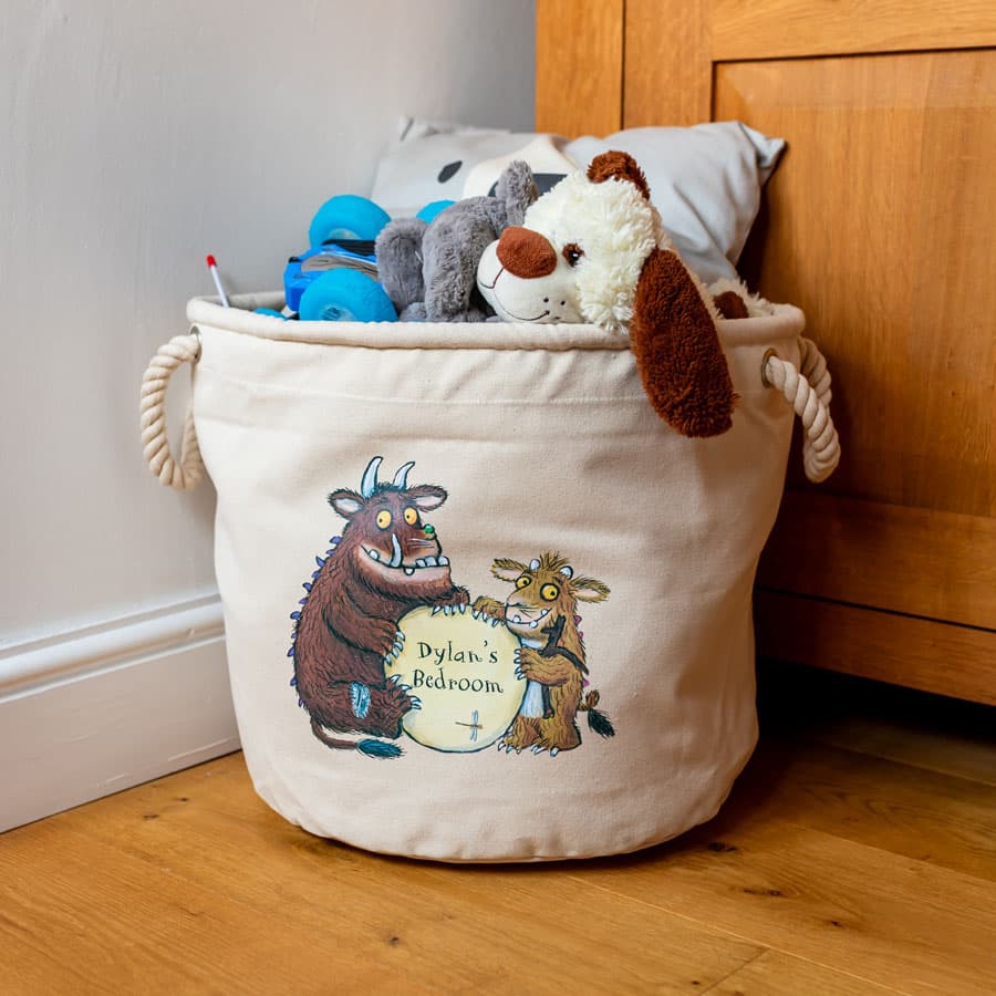 Personalised Gruffalo’s Child nursery storage basket positioned next to a wooden wardrobe – practical canvas bin for toys, books or laundry.