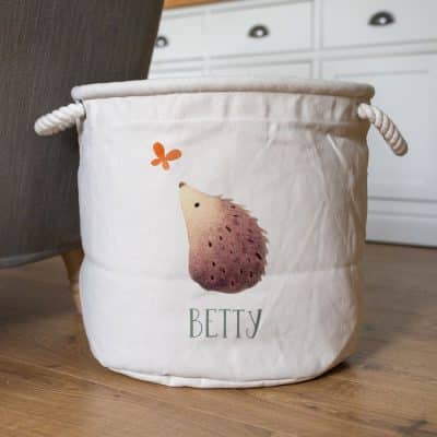 Personalised hedgehog soft storage basket with butterfly detail and name “Betty” – part of the Ginger Betty collection for nursery storage.