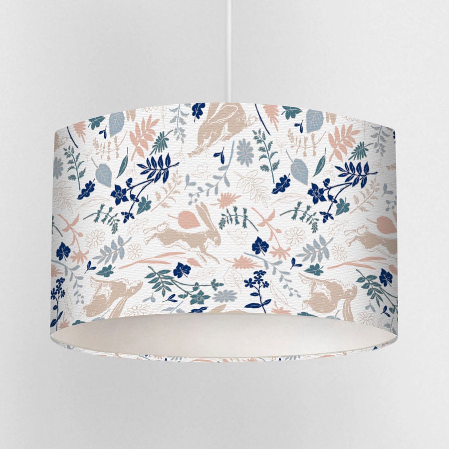 Floral Guess How Much I Love You lampshade featuring Little Nutbrown Hare with wildflowers on a neutral background”